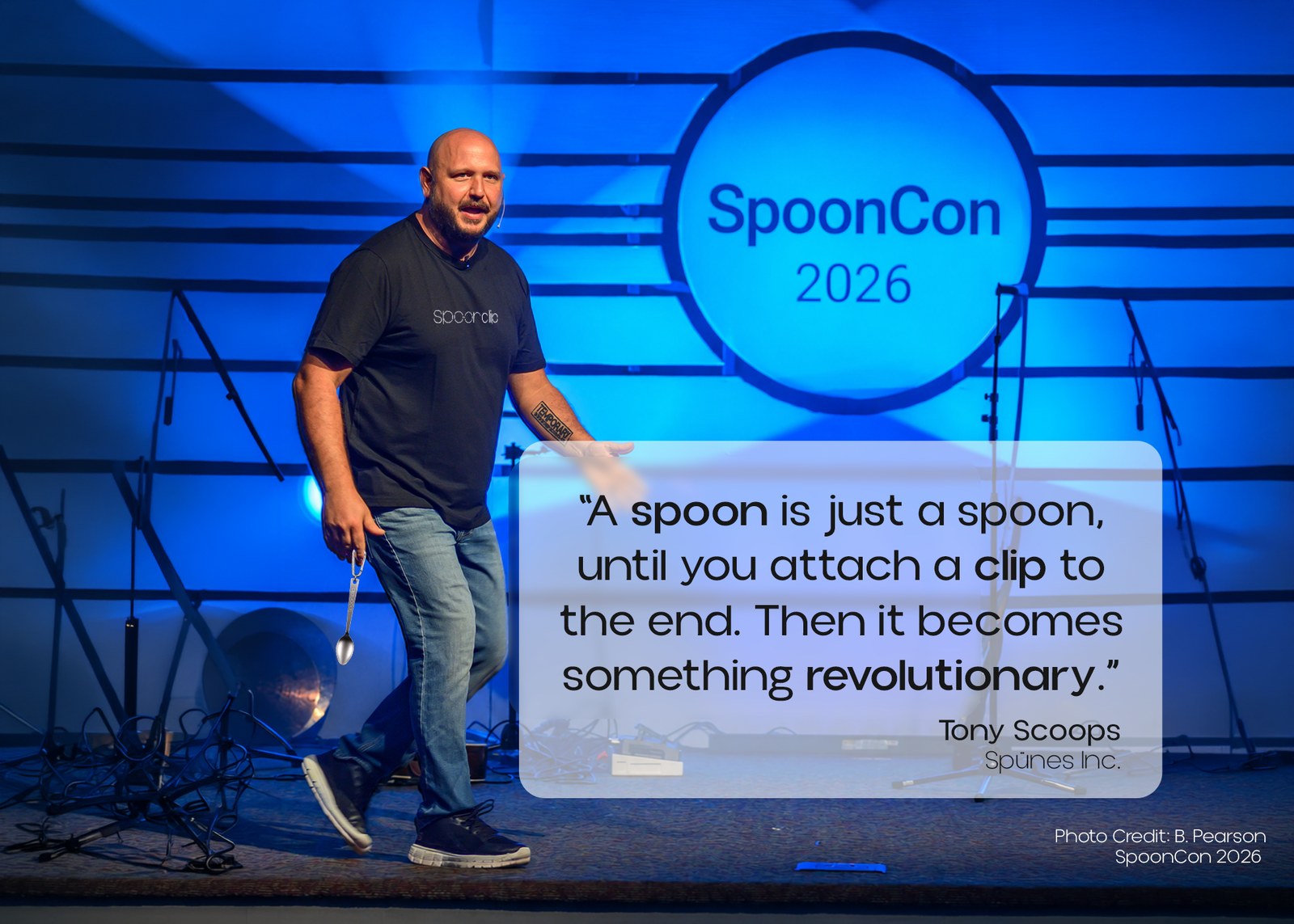 Tony Scoops on stage at SpoonCon 2026. Quote: &ldquo;A spoon is just a spoon, until you attach a clip to the end. Then it becomes something revolutionary.&rdquo;